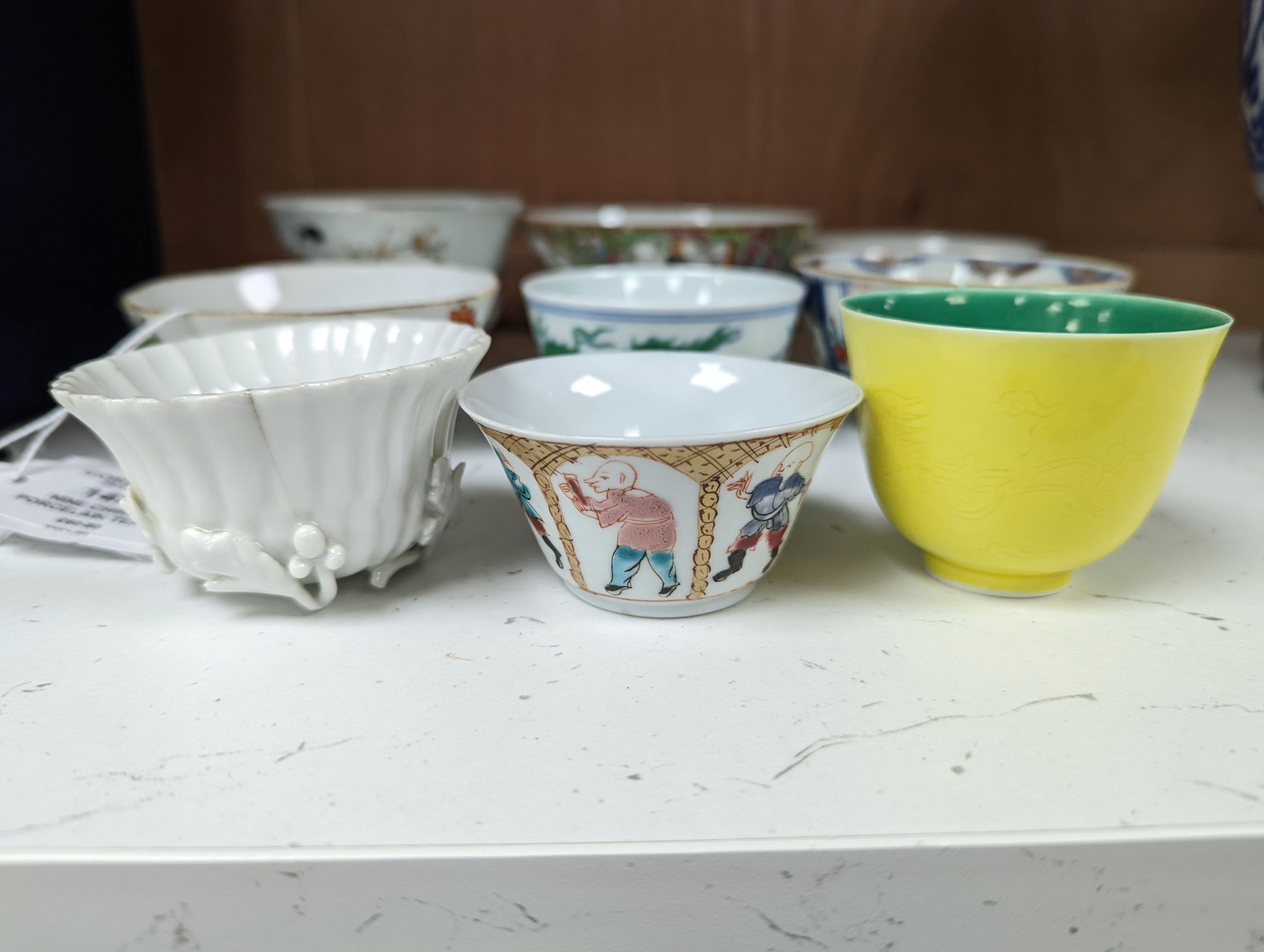 Nine Chinese porcelain tea bowls, tallest 6 cm.